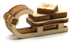 Bild vom Artikel Schlitten mit Geschenken (33  x 12 x 15 mm)